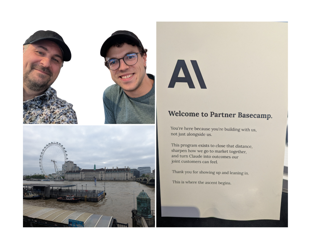 Zwei Personen lächeln in die Kamera, während sie in einem Raum sitzen. Im Hintergrund sind ein Mann und ein Tisch mit Getränken zu sehen. Neben ihnen steht ein Schild mit der Aufschrift "Welcome to Partner Basecamp" und Informationen zu einem Programm. In der unteren Ecke sieht man die Themse und das London Eye im Hintergrund.